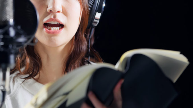 A,Woman,Reading,A,Script.,Voice,Actress.,Narrator.